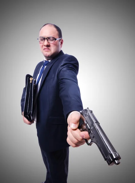 Geschäftsmann mit Waffe gegen das Gefälle — Stockfoto