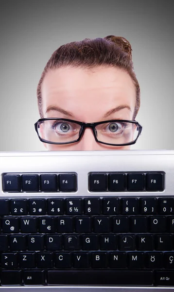 Businesswoman with computer keyboard Stock Picture