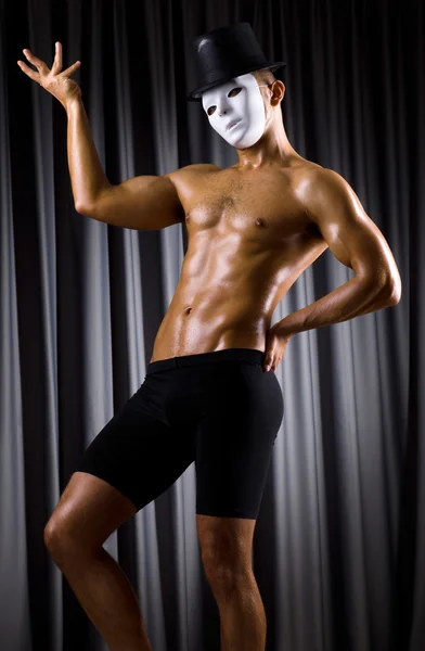 Muscular actor with theatrical mask — Stock Photo, Image