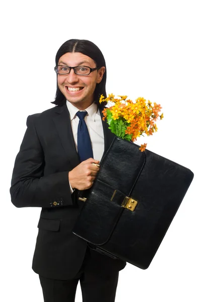 Красивый бизнесмен с цветами и коротенький случай изолирован на белом — стоковое фото