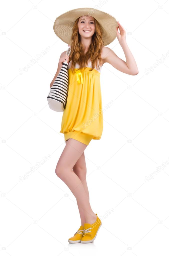 Young woman in yellow summer dress isolated on white