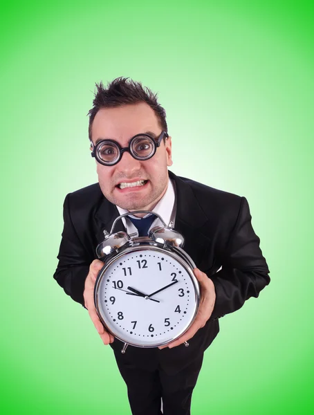 Businessman with clock against the gradient — Stock Photo, Image