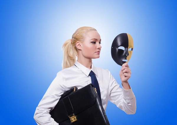 Woman with mask in hypocrisy concept — Stock Photo, Image