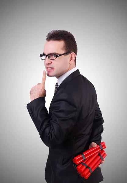 Businessman with dynamite against the gradient — Stock Photo, Image