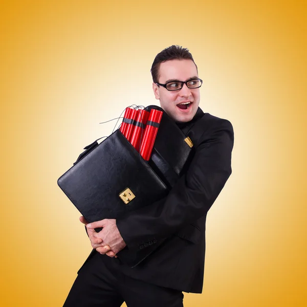 Businessman with dynamite against the gradient — Stock Photo, Image