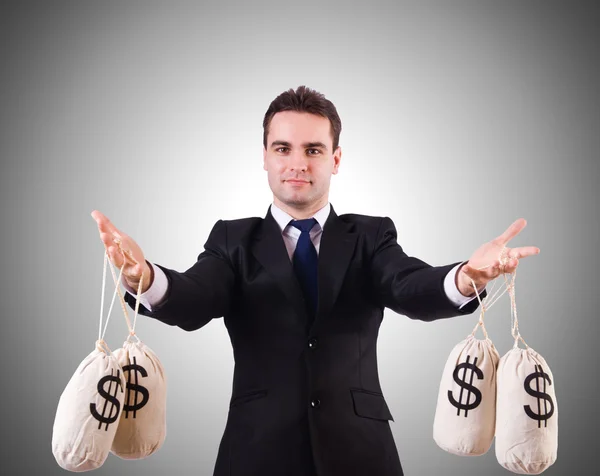 Man with money sacks — Stock Photo, Image