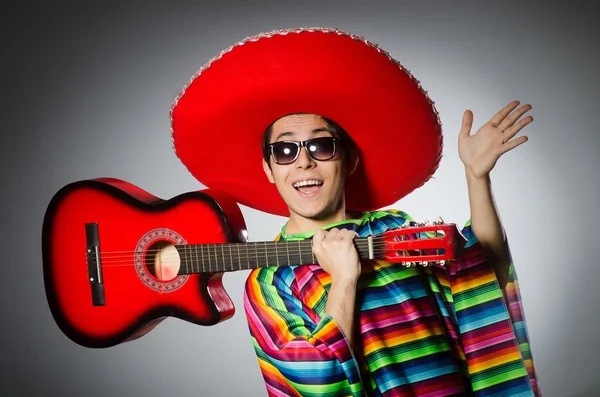 Funny mexican playing on guitar isolated on grey — Stock Photo, Image