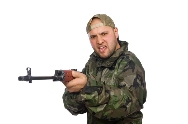 Young man in soldier uniform holding gun isolated on white — Stock Photo, Image