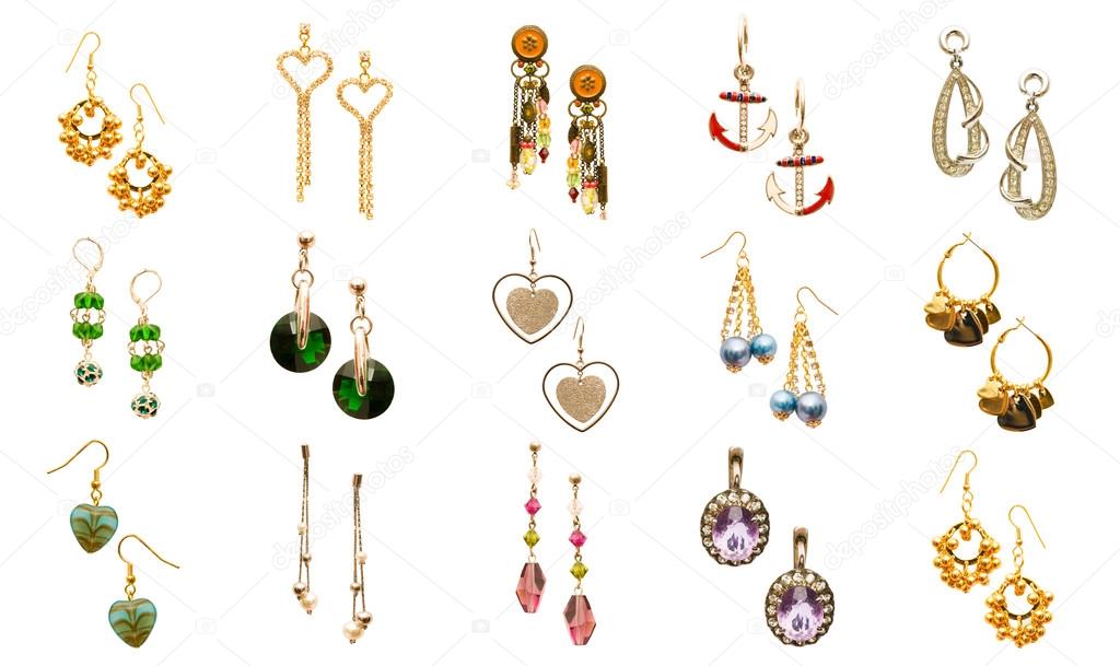 Set of various earrings isolated on white