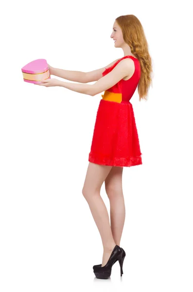 Pretty young girl in red dress holding box — Stock Photo, Image