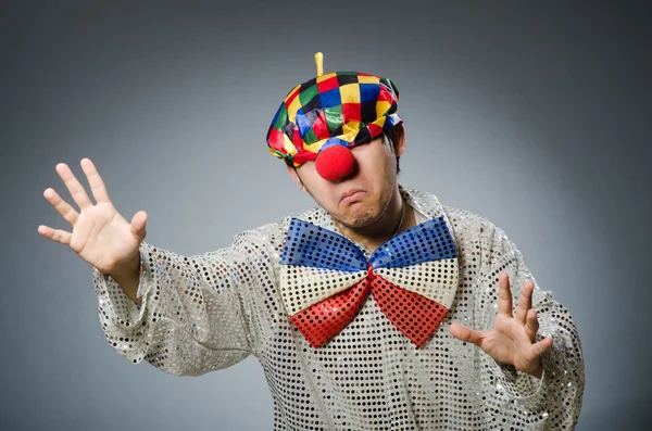 Funny clown against dark background — Stock Photo, Image