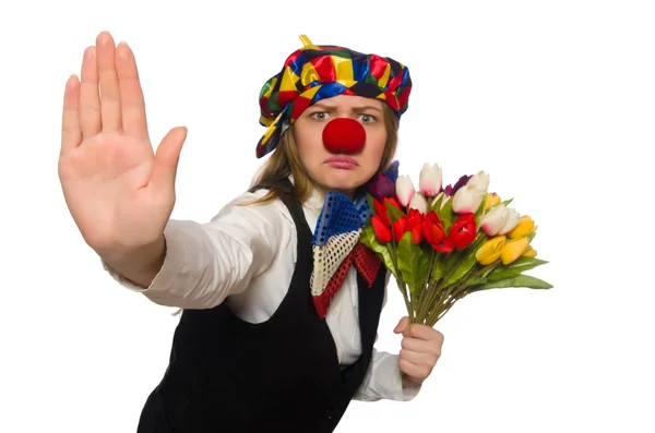 Ganska kvinnlig clown med blommor isolerad på vit — Stockfoto
