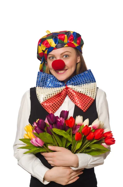 Simpatico clown femminile con fiori isolati su bianco — Foto Stock