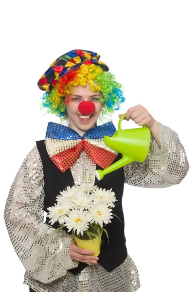 Kvinnlig clown med blommor — Stockfoto