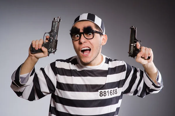 Funny prisoner with weapon — Stock Photo, Image