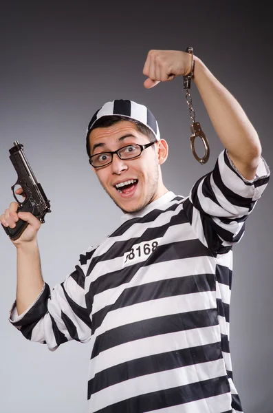 Funny prisoner with weapon — Stock Photo, Image