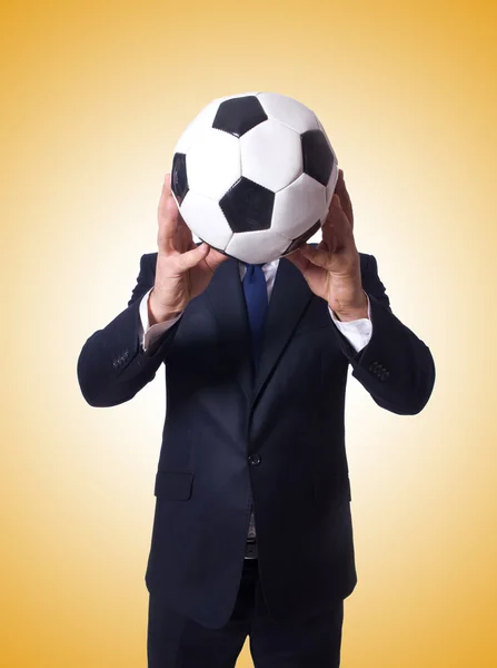 Businessman with ball against the gradient — Stock Photo, Image