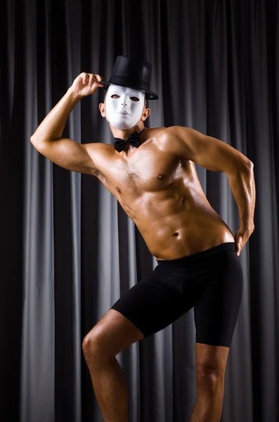 Muscular man posing on grey background