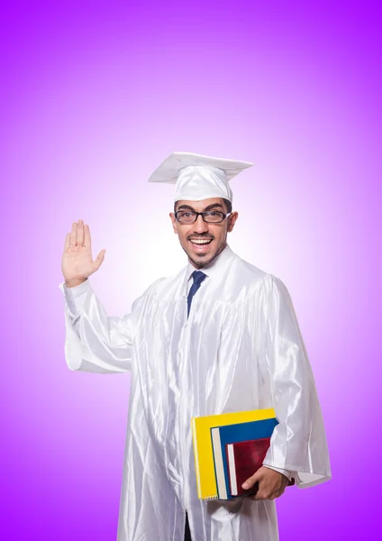 Giovane studente maschio contro il gradiente — Foto Stock