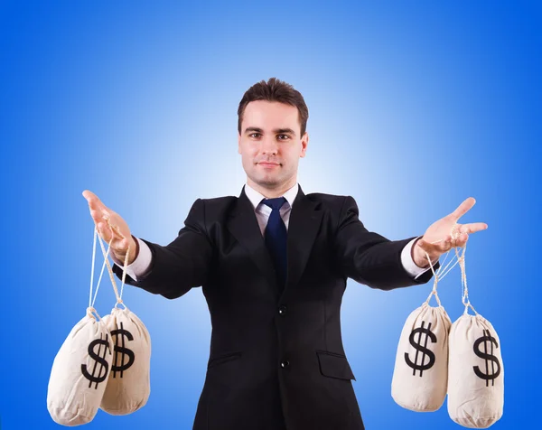 Man with money sacks — Stock Photo, Image