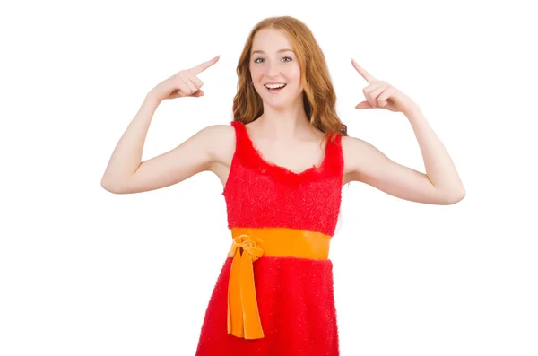 Menina bonita nova em vestido vermelho apontando isolado no branco — Fotografia de Stock