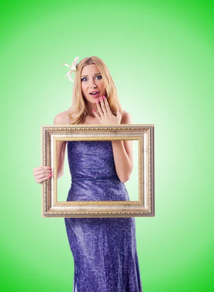 Woman in dress with picture frame — Stock Photo, Image