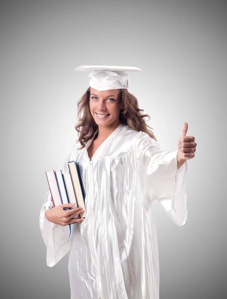 Graduate with books — Stock Photo, Image