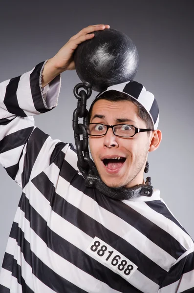 Funny prisoner in chains isolated on gray — Stock Photo, Image