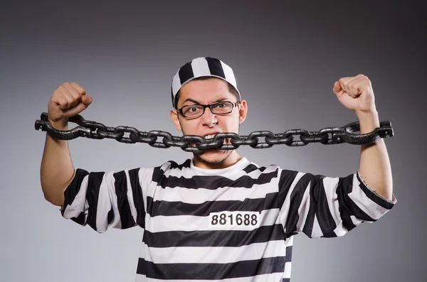 Funny prisoner in chains isolated on gray — Stock Photo, Image