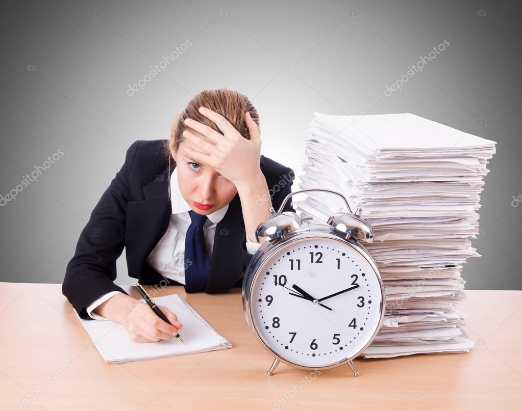 Woman businesswoman with giant alarm clock