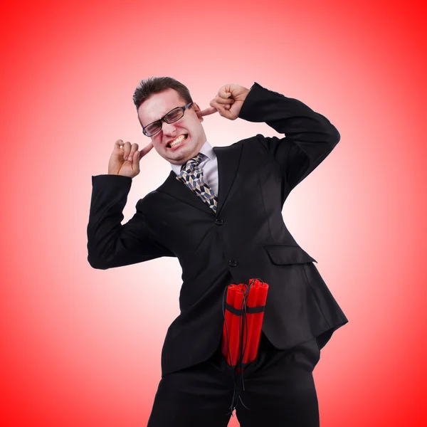 Businessman with dynamite against the gradient — Stock Photo, Image