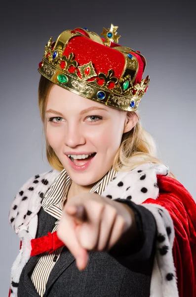 Pretty businessman with crown isolated on gray — Stock Photo, Image