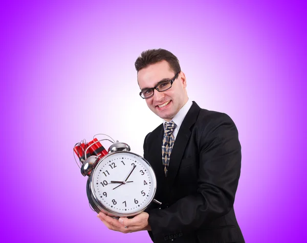 Man with time bomb against the gradient — Stock Photo, Image