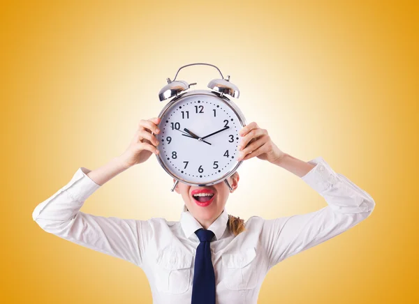 Businesswoman with giant clock — Stock Photo, Image