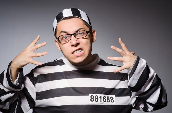 Funny prisoner isolated on gray — Stock Photo, Image