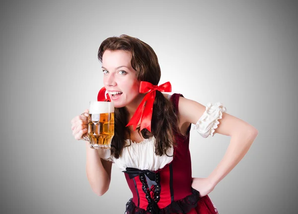 Bavarian girl with tray against the gradient — Stock Photo, Image