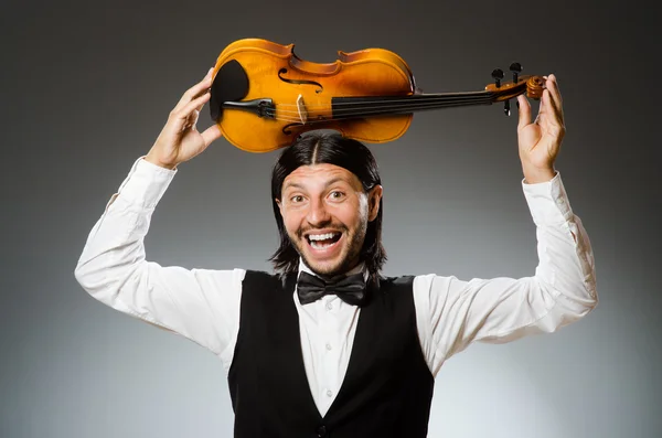 Man playing violin in musical concept — Stock Photo, Image
