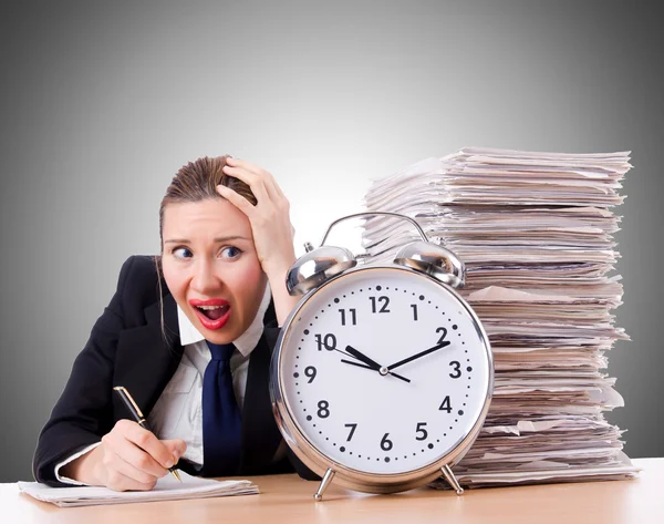 Woman businesswoman with giant alarm clock — Stock Photo, Image