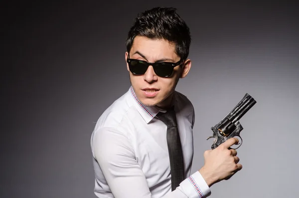 Young man in cool sunglasses isolated on gray — Stock Photo, Image