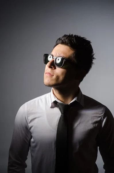 Young man in cool sunglasses isolated on gray — Stock Photo, Image