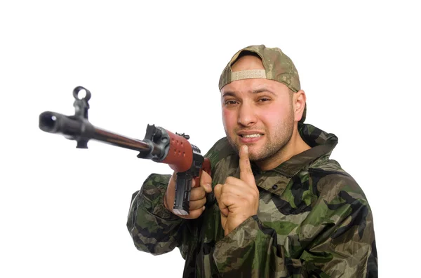 Jovem de uniforme soldado segurando arma isolada em branco — Fotografia de Stock