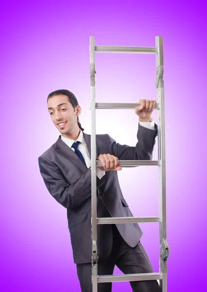 Businessman climbing the ladder against the gradient — Stock Photo, Image