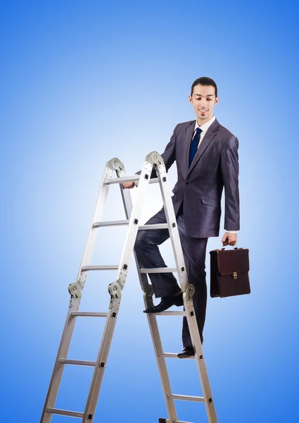 Businessman climbing career ladder against gradient — Stock Photo, Image