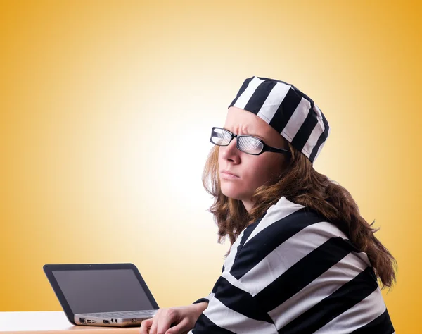 Criminal hacker with laptop against gradient — Stock Photo, Image