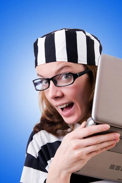 Criminal hacker with laptop against gradient — Stock Photo, Image