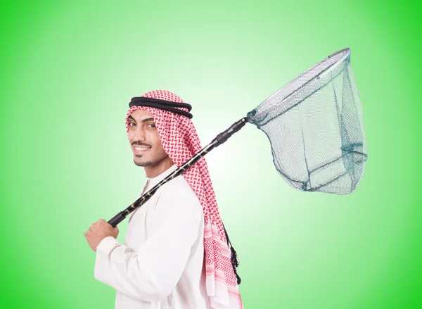 Arab businessman with catching net against gradient — Stock Photo, Image