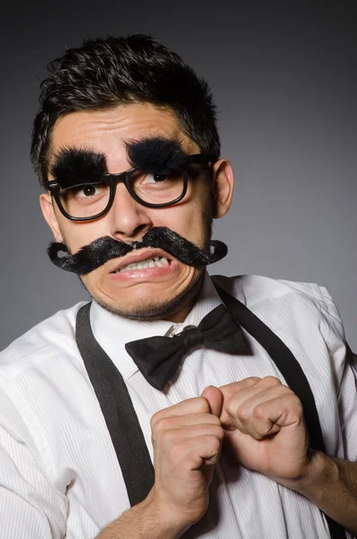 Young man with false moustache — Stock Photo, Image