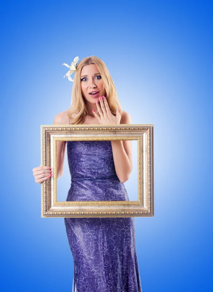 Woman with picture frame — Stock Photo, Image