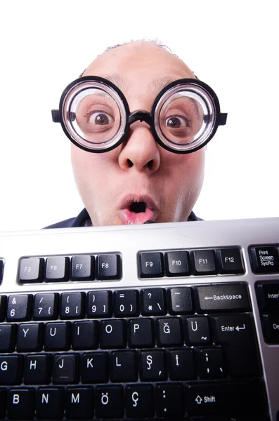 Homem engraçado com teclado isolado no branco Imagem De Stock