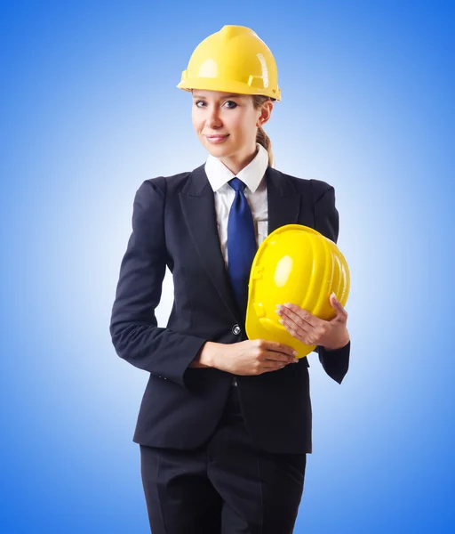 Young businesswoman with hard hat — Stock Photo, Image